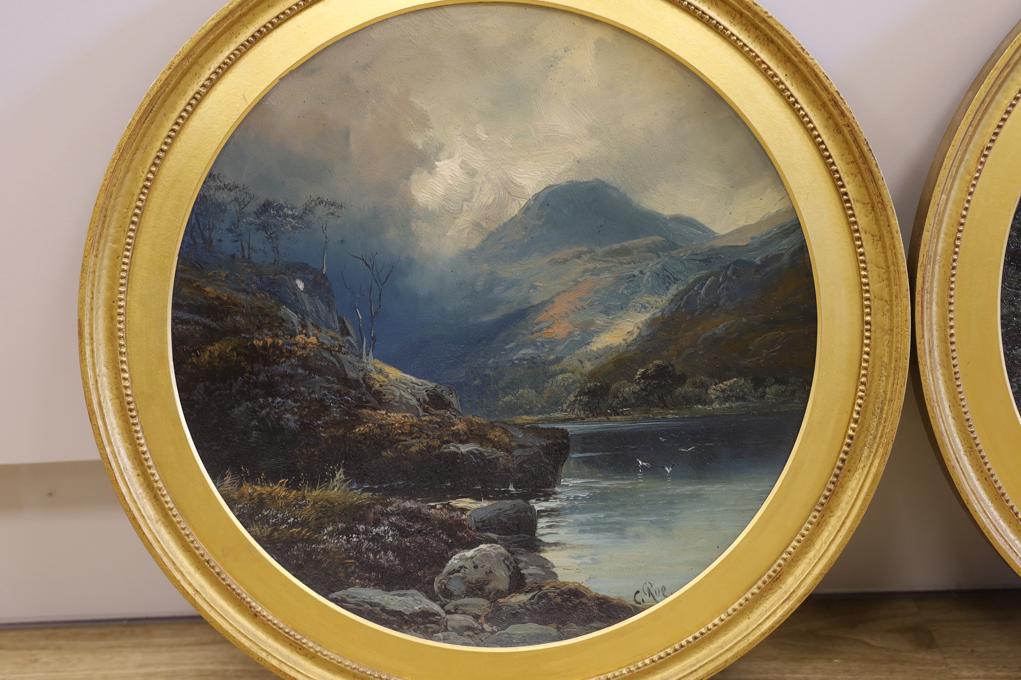 Late 19th / early 20th century, pair of oils on concave tin panels, Rocky river landscapes, each 39cm diameter